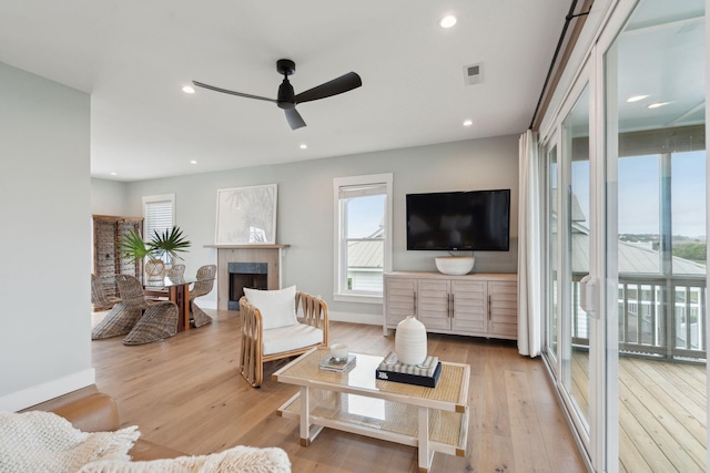 1568 E Ashley Ave, Folly Beach, SC 29439 - living room with a ceiling fan, wood finished floors, a high end fireplace, recessed lighting, and baseboards
