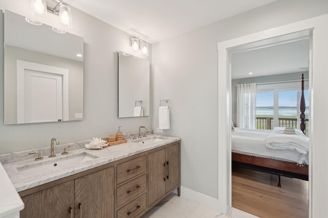 1568 E Ashley Ave, Folly Beach, SC 29439 - full bathroom with double vanity, ensuite bathroom, and baseboards