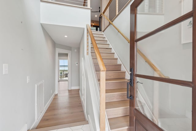1568 E Ashley Ave, Folly Beach, SC 29439 - stairway featuring baseboards, recessed lighting, and wood finished floors