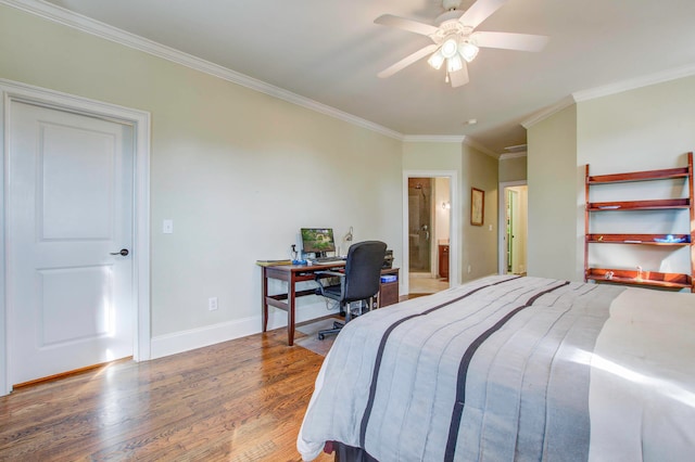 bedroom featuring crown molding, ensuite bath, wood-type flooring, and ceiling fan