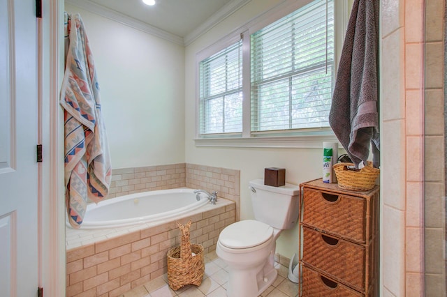 bathroom featuring tile flooring, tiled tub, crown molding, toilet, and vanity