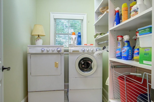 washroom with washing machine and clothes dryer