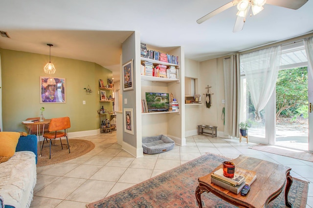 tiled living room featuring ceiling fan