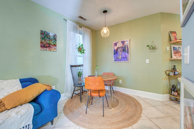 dining room with light tile floors