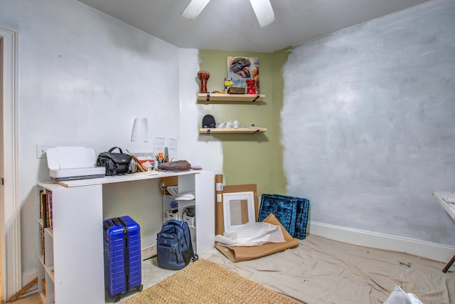 interior space with ceiling fan