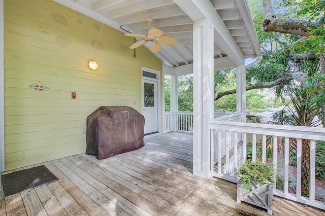 wooden terrace with a grill and ceiling fan