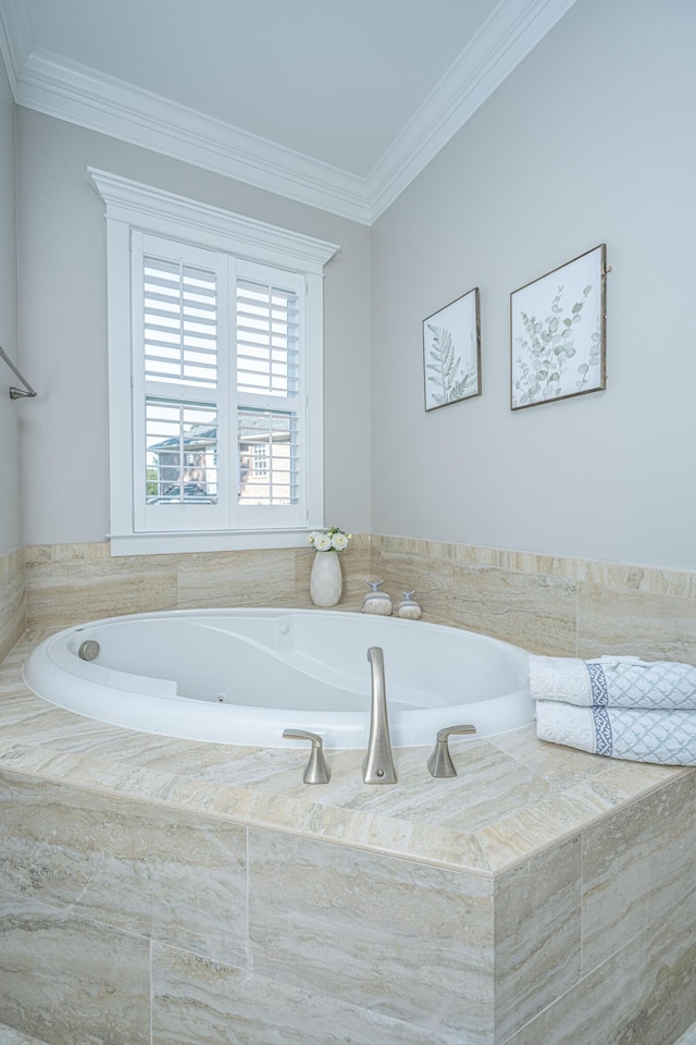 bathroom featuring a garden tub and ornamental molding