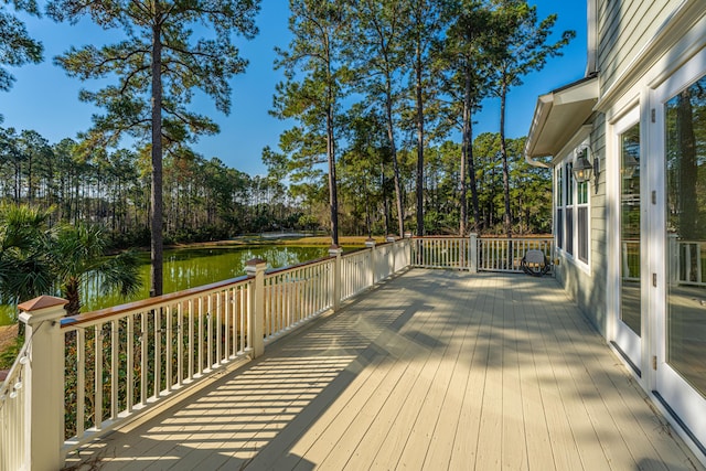 wooden deck featuring a water view