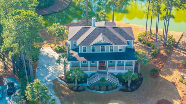 birds eye view of property with a water view