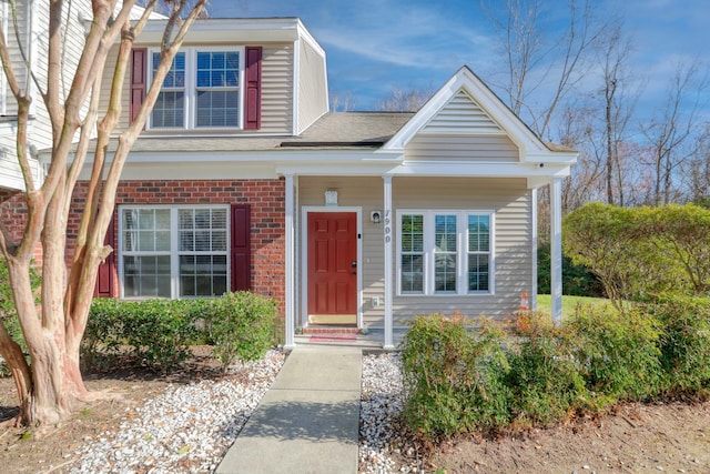 traditional home featuring brick siding