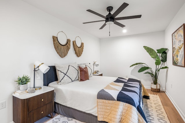 bedroom featuring light wood-type flooring and ceiling fan