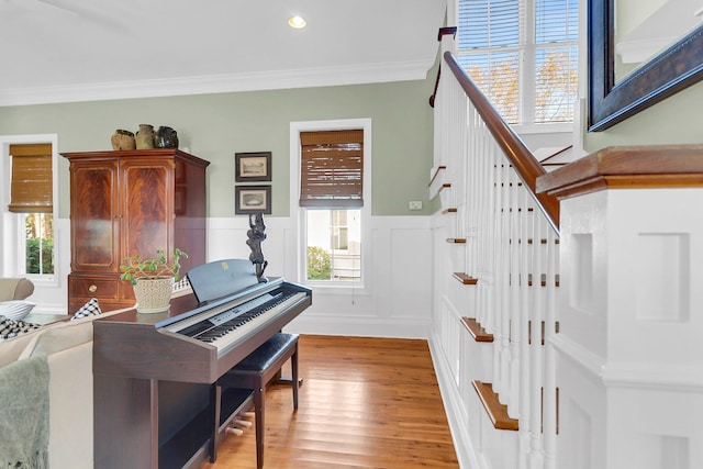 misc room with hardwood / wood-style flooring and crown molding