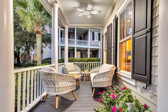 wooden terrace featuring ceiling fan