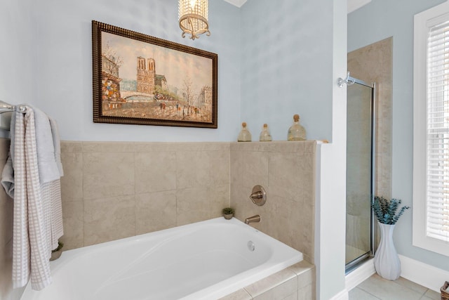 bathroom with shower with separate bathtub, tile patterned floors, and a healthy amount of sunlight