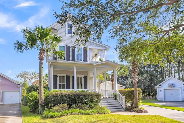 view of front of home with a garage, covered porch, and an outdoor structure