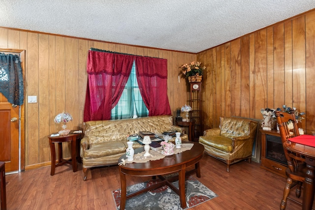 12 Grove St, Charleston, SC 29403 - living area featuring a textured ceiling, wood finished floors, wood walls, and crown molding