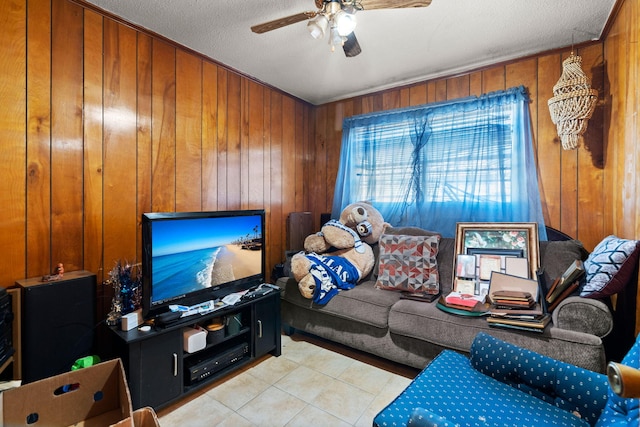 12 Grove St, Charleston, SC 29403 - living room featuring ceiling fan, light tile patterned floors, wood walls, and a textured ceiling