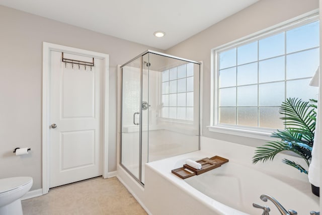 bathroom featuring toilet, tile patterned floors, and independent shower and bath