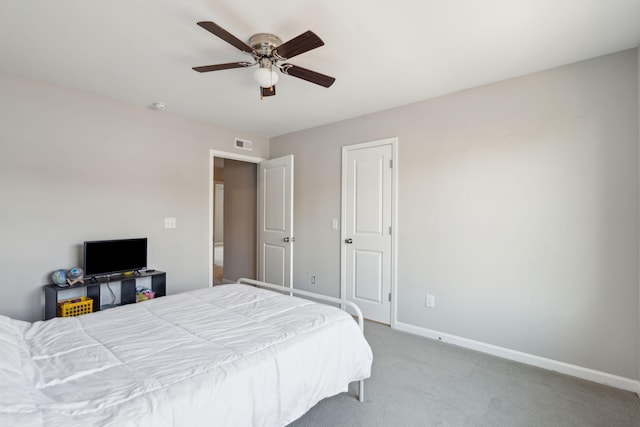 bedroom featuring light colored carpet and ceiling fan