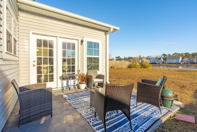 view of patio featuring a water view