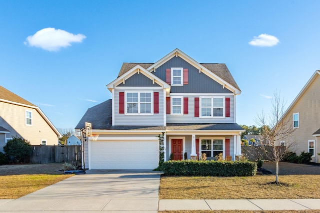 view of front of home with a front lawn and a garage