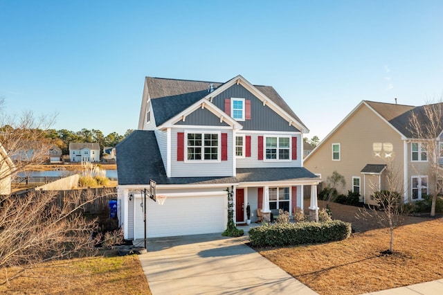 view of front of property featuring covered porch and a garage