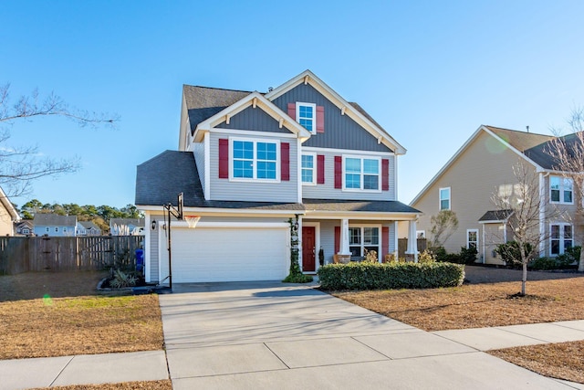 view of front of house featuring a porch and a garage