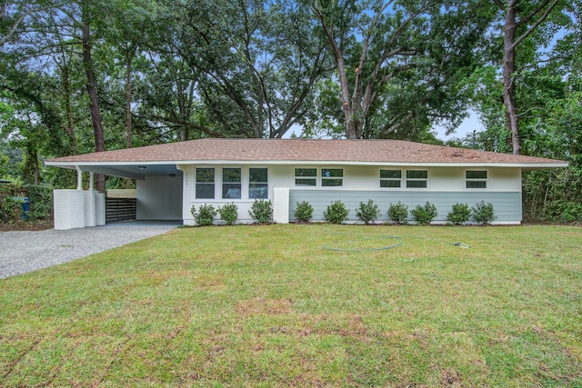 2135 Clayton St, Charleston, SC 29414 - ranch-style house featuring gravel driveway, a carport, and a front lawn