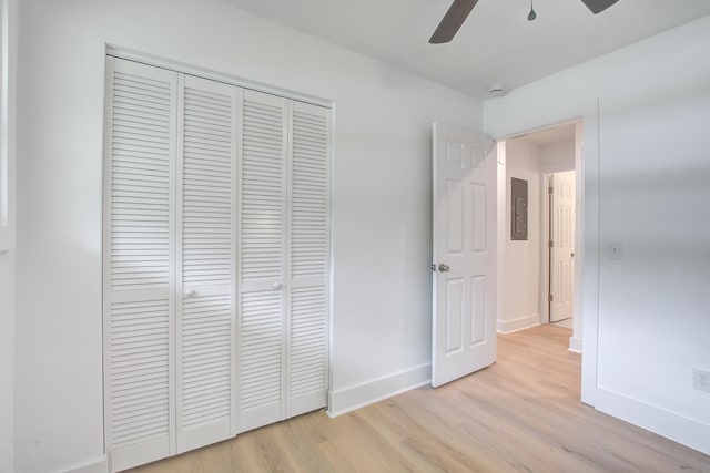 2135 Clayton St, Charleston, SC 29414 - unfurnished bedroom featuring light wood-style flooring, a closet, electric panel, baseboards, and a ceiling fan