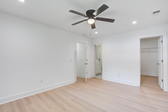 2135 Clayton St, Charleston, SC 29414 - unfurnished bedroom featuring light wood-type flooring, a spacious closet, recessed lighting, baseboards, and ensuite bath