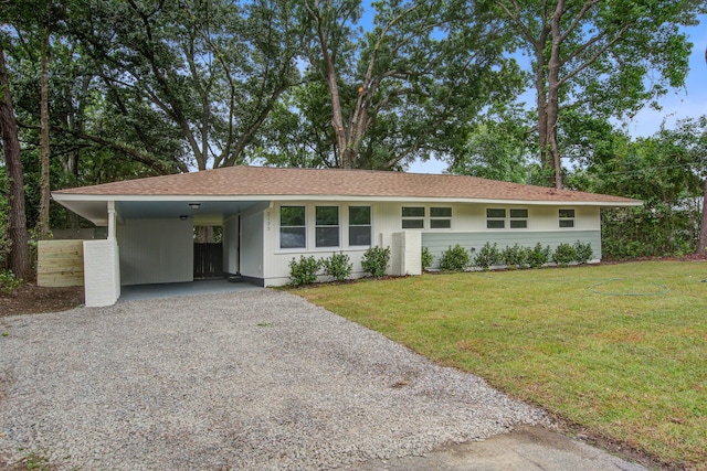 2135 Clayton St, Charleston, SC 29414 - ranch-style home with driveway, a front lawn, and an attached carport