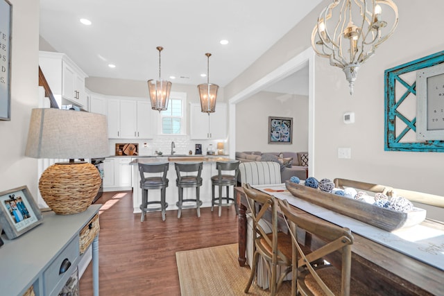 dining space with dark hardwood / wood-style flooring