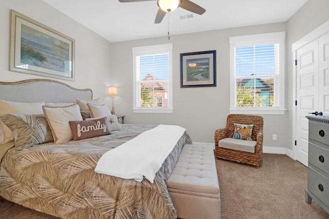 carpeted bedroom with ceiling fan