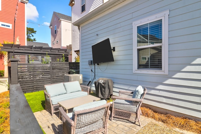 view of patio / terrace featuring an outdoor living space and central AC unit