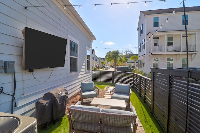 balcony with cooling unit and outdoor lounge area