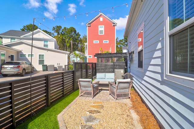 view of yard featuring a patio, outdoor lounge area, and a pergola