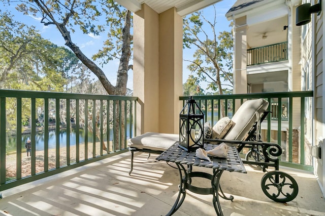 balcony featuring a water view