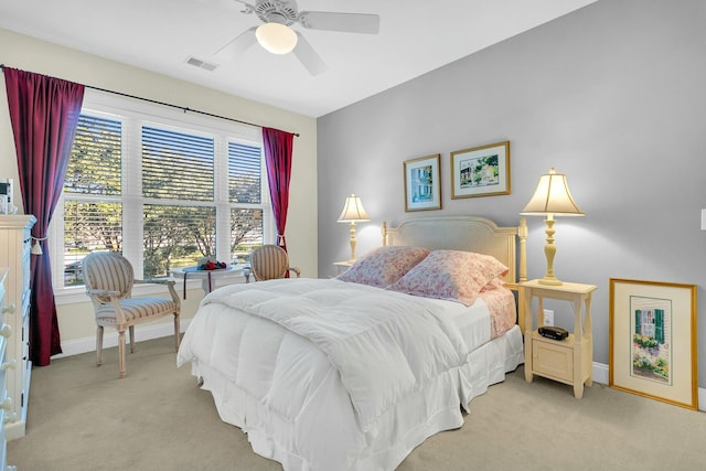 bedroom featuring light carpet and ceiling fan