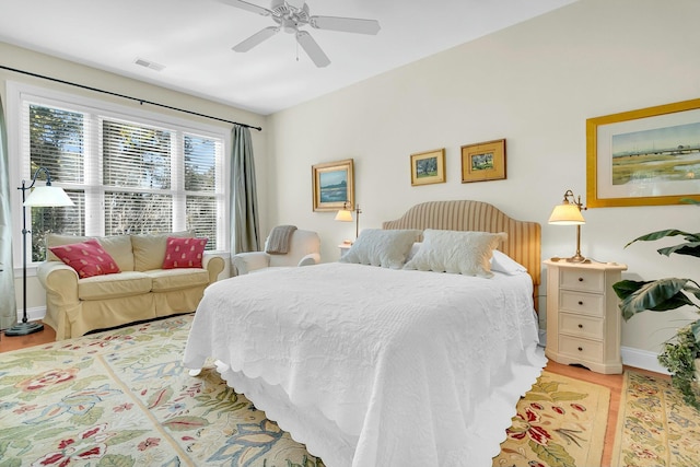 bedroom featuring ceiling fan and wood-type flooring