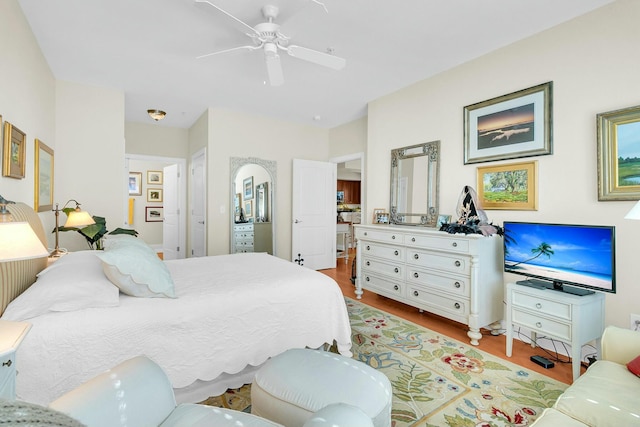 bedroom with ceiling fan and light hardwood / wood-style flooring