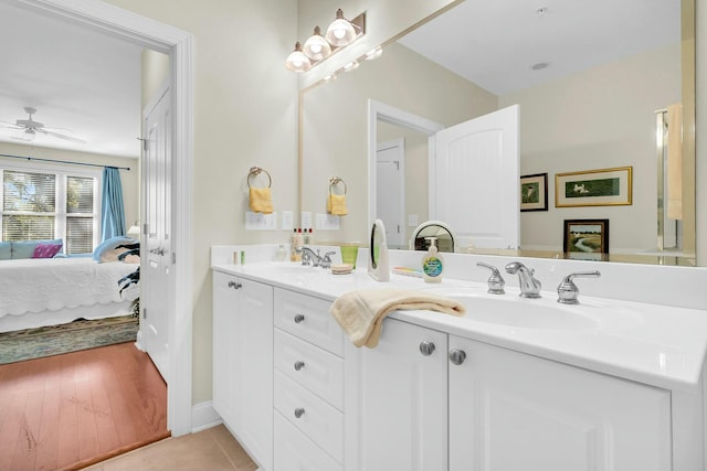 bathroom featuring ceiling fan, tile patterned floors, and vanity