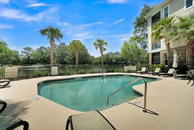 view of pool featuring a patio