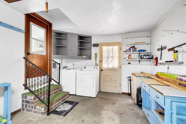 interior space with washer and clothes dryer and a workshop area