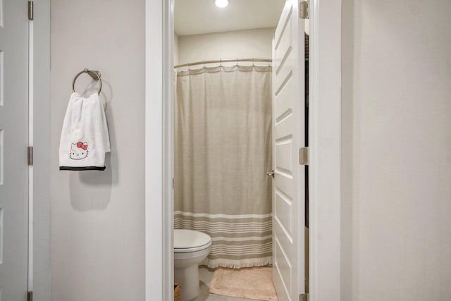 bathroom with toilet and walk in shower