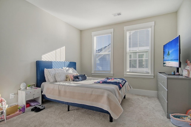 bedroom with light carpet