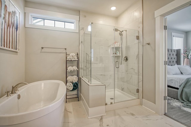 bathroom featuring independent shower and bath