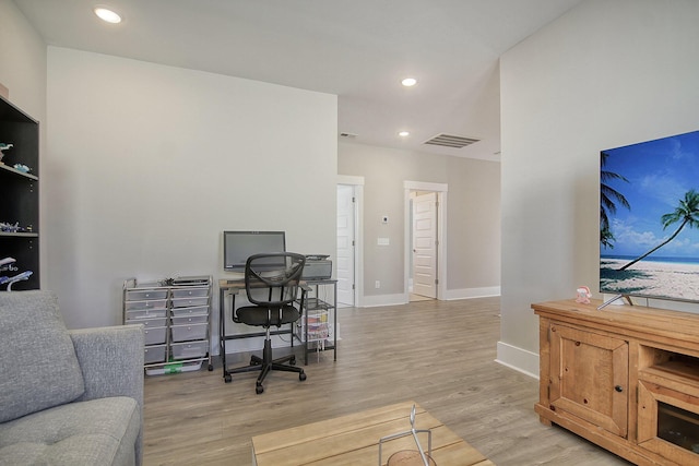 office area with light hardwood / wood-style floors