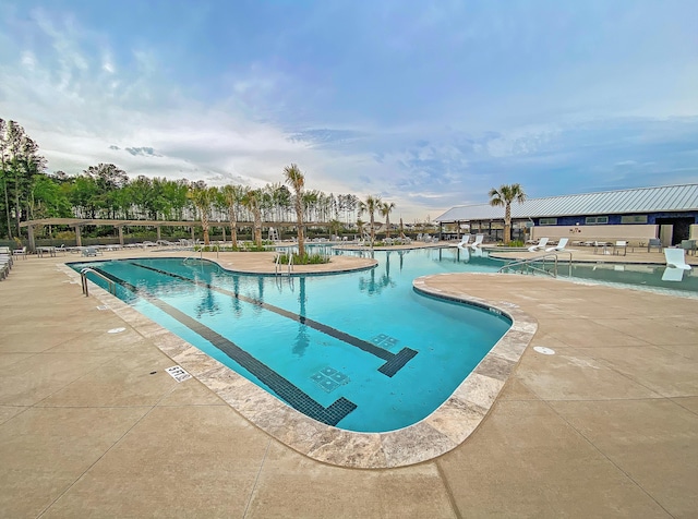 view of pool featuring a patio