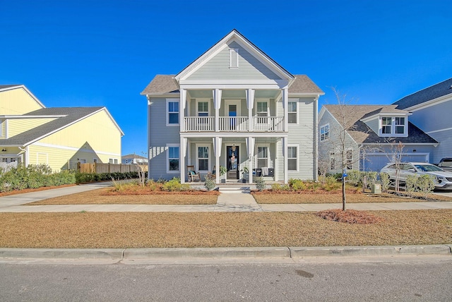 view of front of house featuring a balcony and a porch