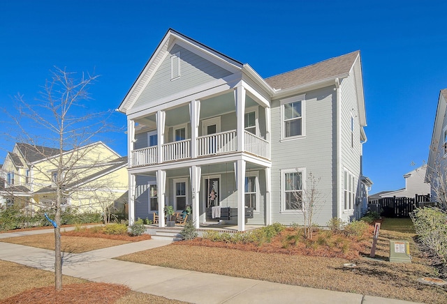 view of front of house featuring a porch and a balcony